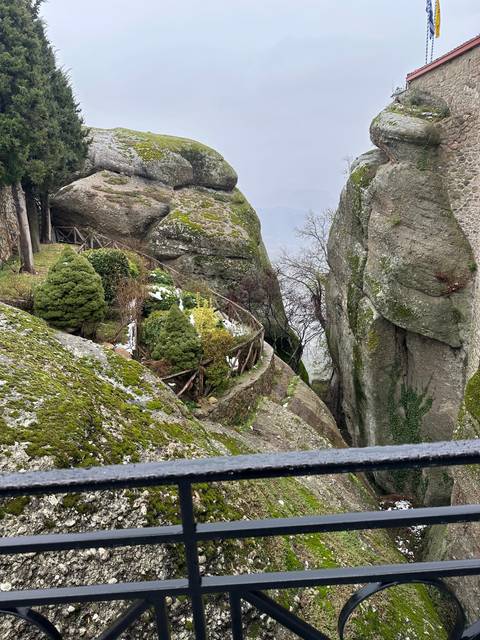 Rock formation partially covered with snow.