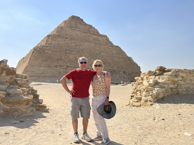 Couple posing in front of a pyramid