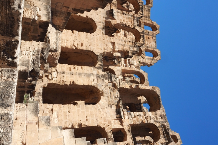       Close-up of ancient ruins against a clear blue sky.
  
