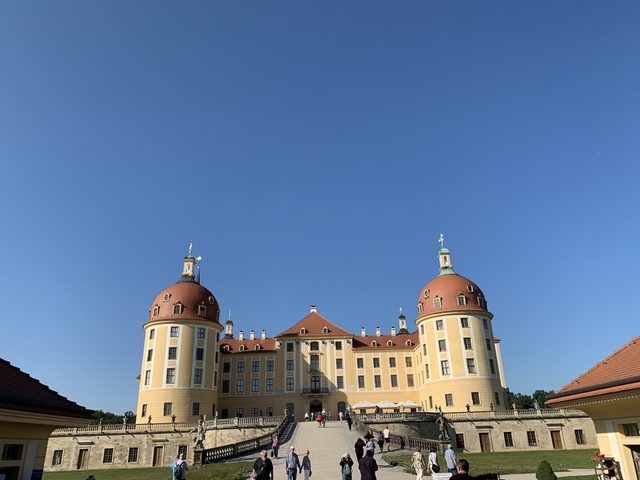 Baroque style palace under clear blue sky.
