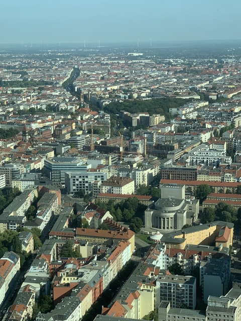 Cityscape featuring a mix of modern and historic buildings.