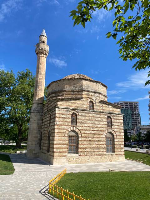       A historic stone structure with a minaret.
  