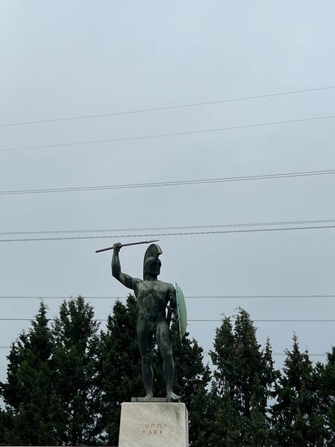 Statue of a warrior with shield and spear.
