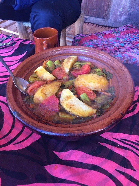       A traditional Moroccan dish with vegetables and spices.
  