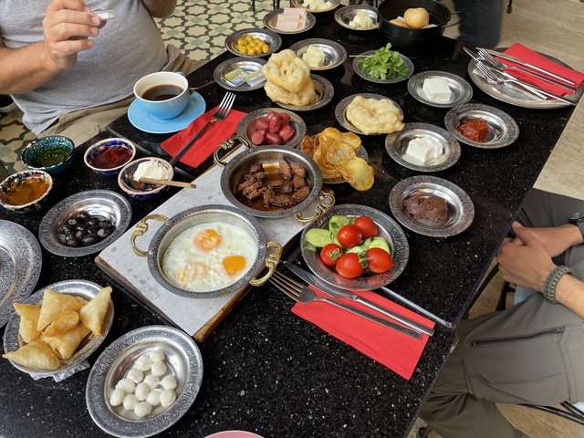       Variety of traditional foods served on a table.
  