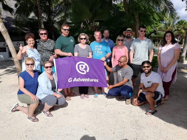 Group photo with a tour flag.