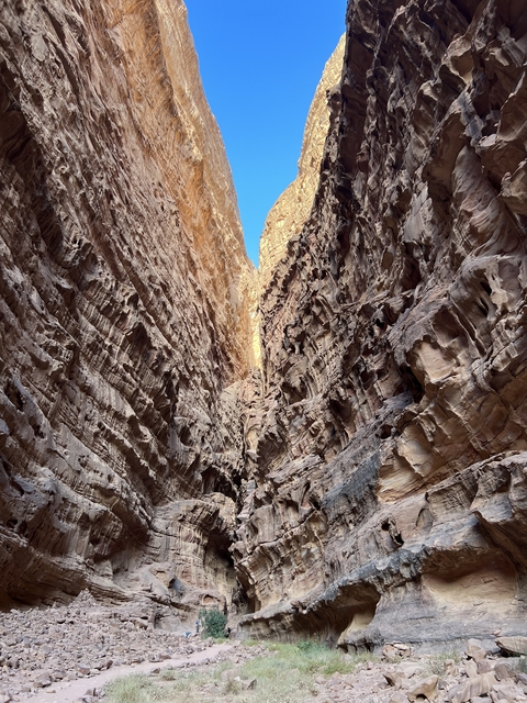 Narrow rock canyon with a view of the sky