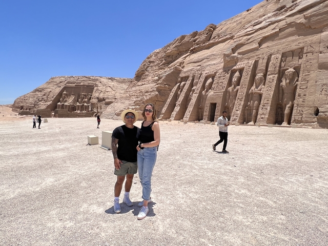 Two tourists in front of the Abu Simbel temple