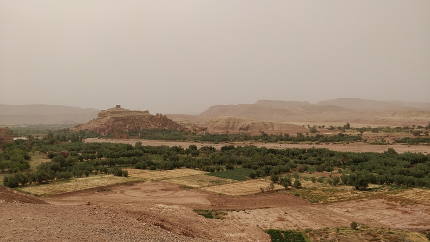       Desert landscape with ancient structures.
  