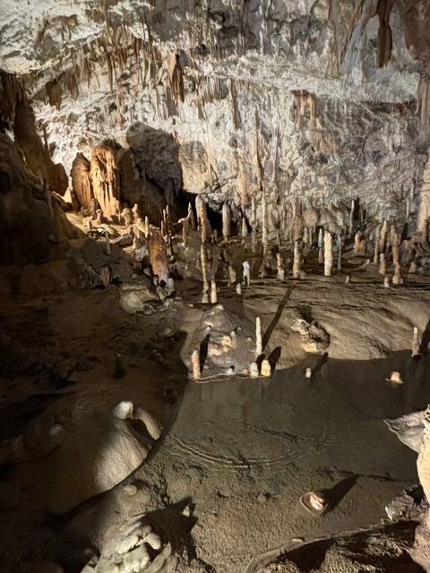 Cave interior with rock formations.
