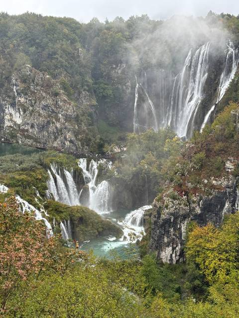       Waterfalls with lush greenery.
  