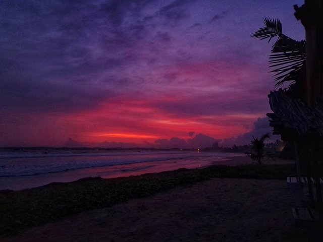       Dramatic sunset over the ocean with striking colors.
  