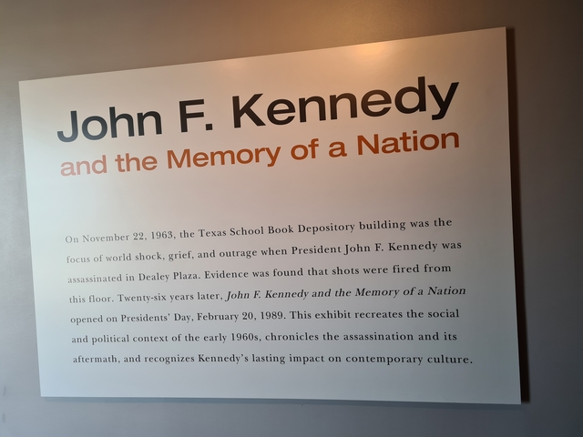 Informational board about JFK and Dallas history.