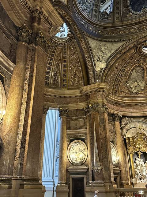 Details of a richly decorated interior with columns.