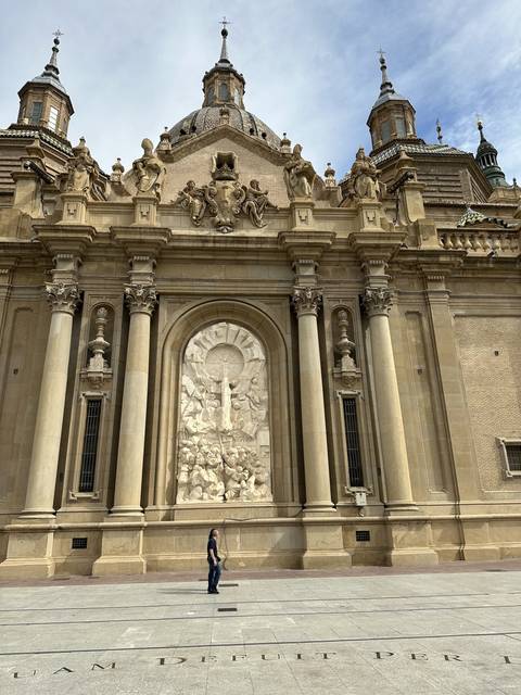 Facade of a grand historical building with sculptures.