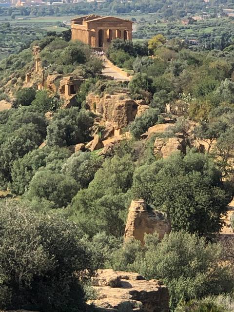       Ancient ruins in a hilly landscape.
  