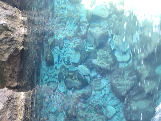      Clear turquoise water with rocky bottom.
  