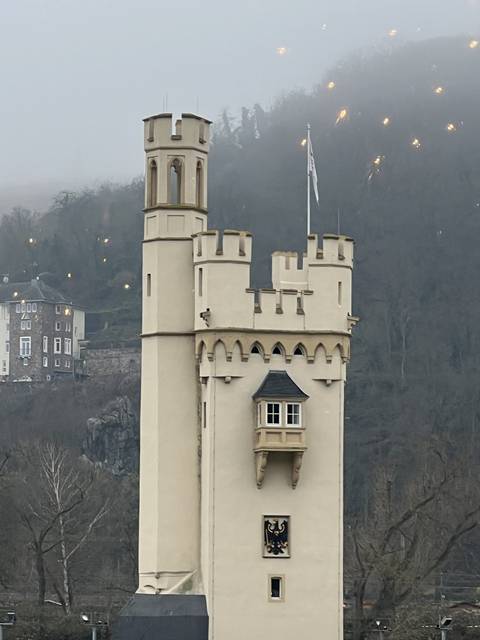 Tall, narrow castle-like building with flag