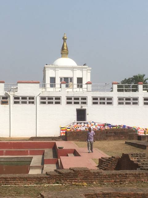       Buddhist temple with prayer flags.
  