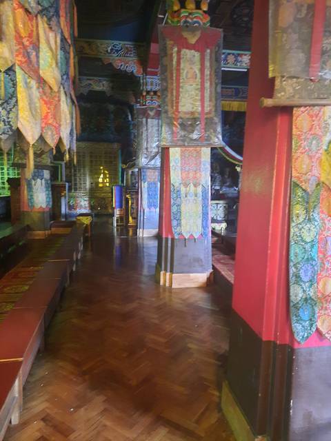       Interior view of a colorful temple with intricate decor.
  