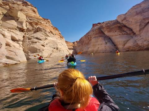 Kayaking adventure in a river canyon.
