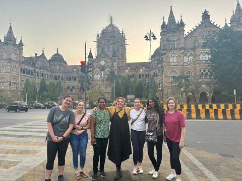 Group in front of a historical building.