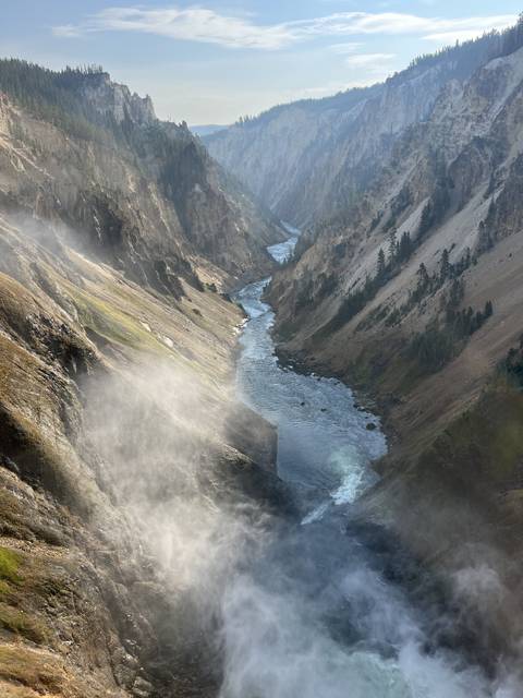 Steam rising from a canyon or gorge.