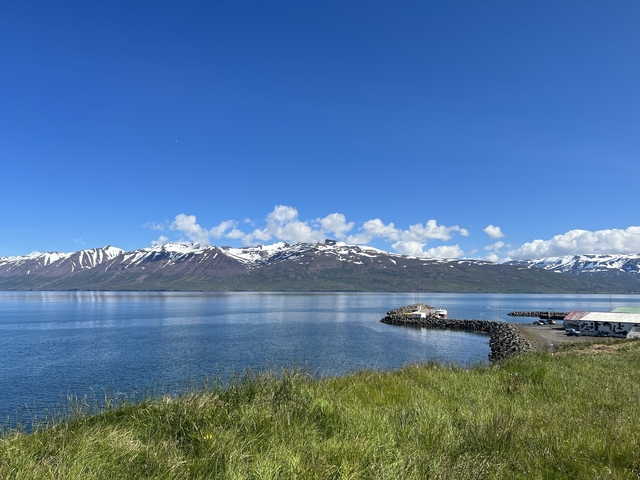 Mountain landscape with a calm body of water.