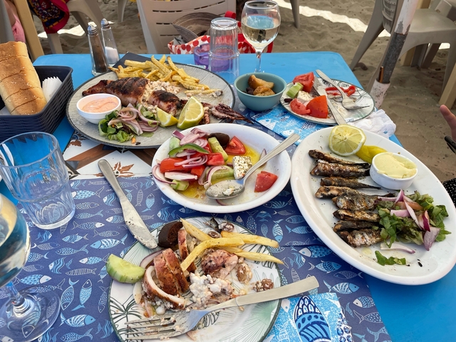       Assorted seafood dishes on a table at a restaurant.
  