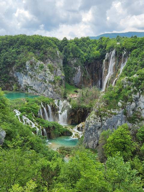 Spectacular waterfalls and lush green landscape.