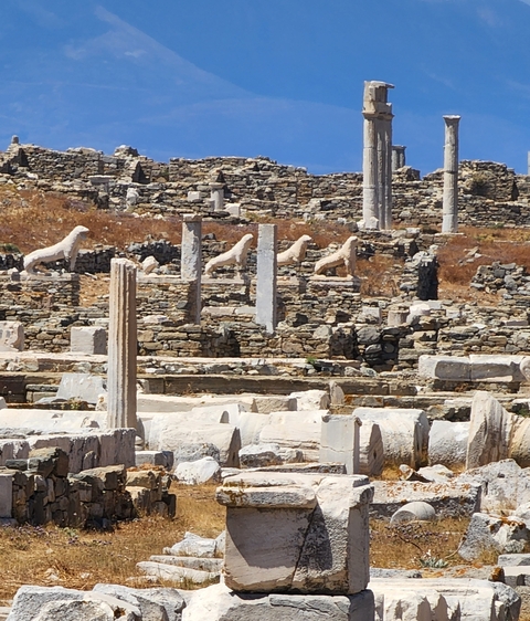       Ancient site with statues and columns.
  