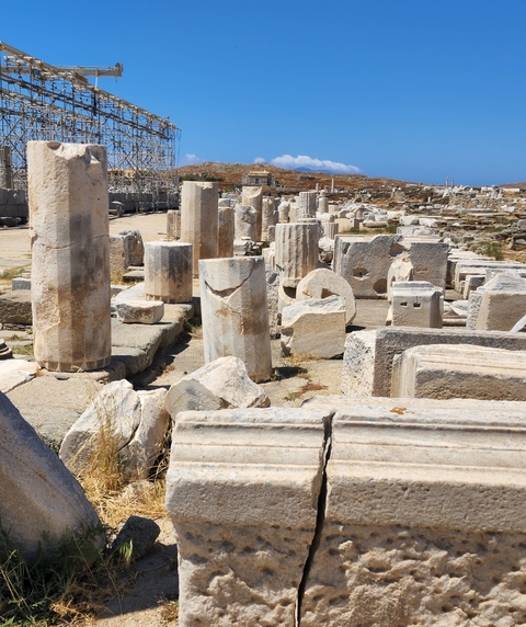       Stone ruins scattered at an archaeological site.
  