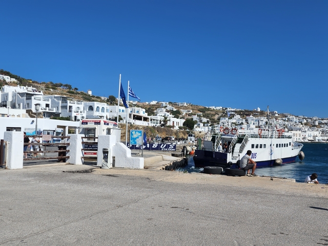      Ferry docking at a seaside town.
  