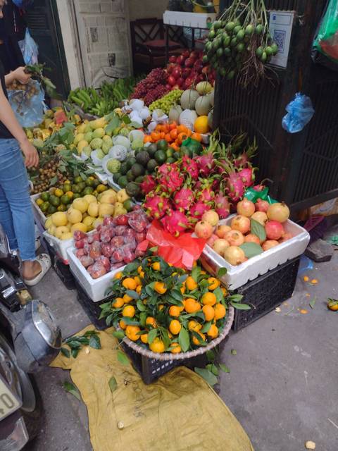 A vendor's display of colorful fruits at a market.