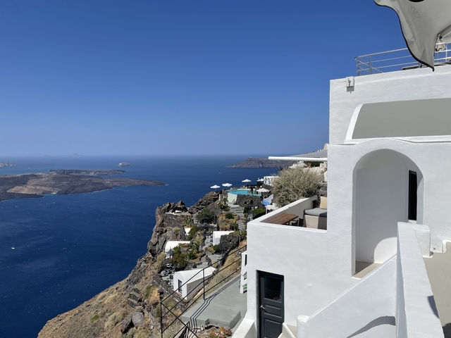       A view of the sea from a hotel balcony in Santorini.
  