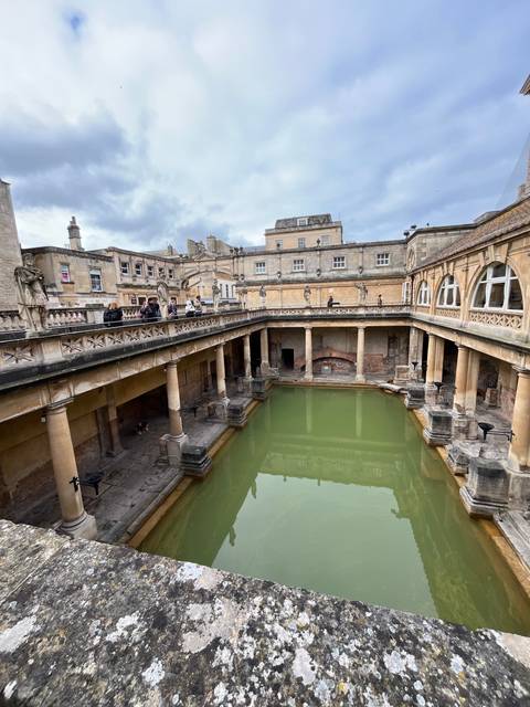      Tourist attraction with historical architecture and a pool.
  