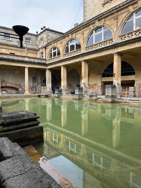       Historic site with pool and architectural structures.
  