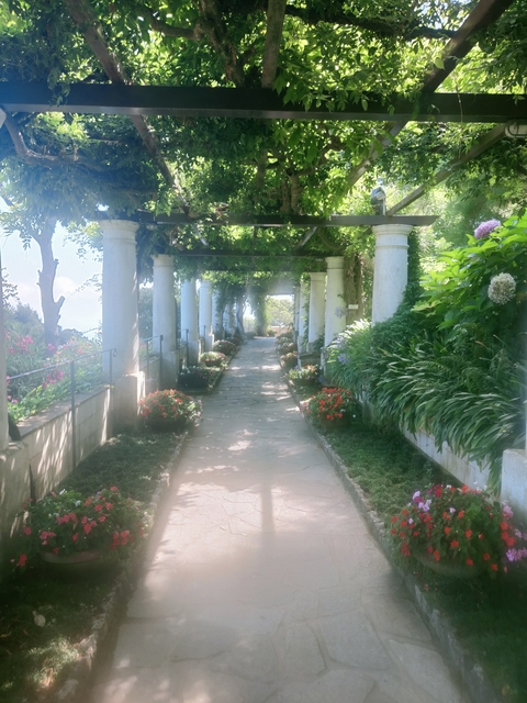      Garden pathway with flowers and columns
  