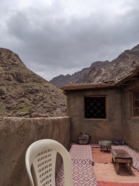 Mountainous landscape with traditional stone building