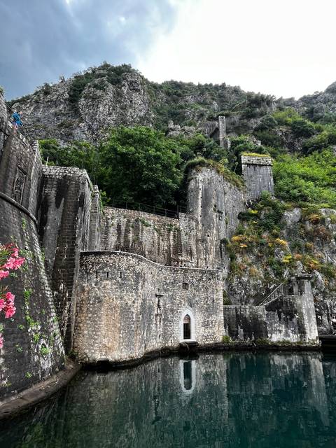       Ruined ancient structure surrounded by nature.
  