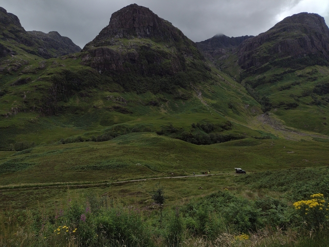 A scenic view of lush green hills in Scotland.