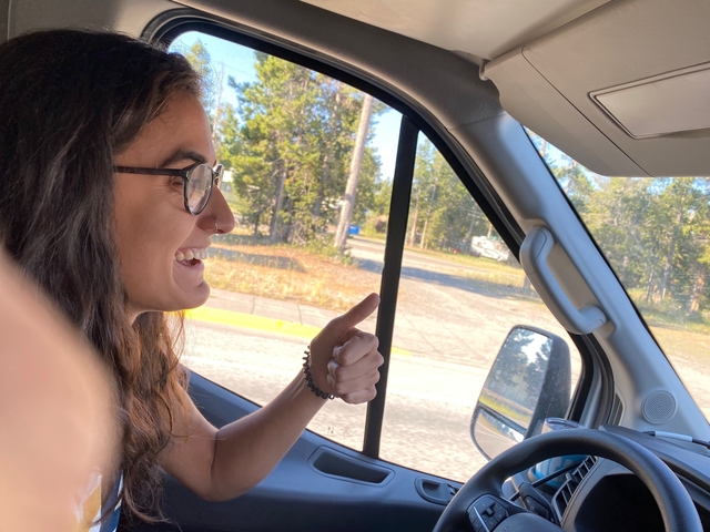 Person smiling while driving.