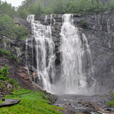 A massive waterfall cascading down a rocky cliff.