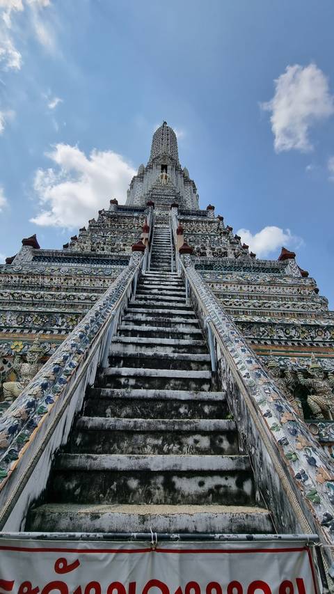       Decorative temple with intricate designs and a tall spire
  