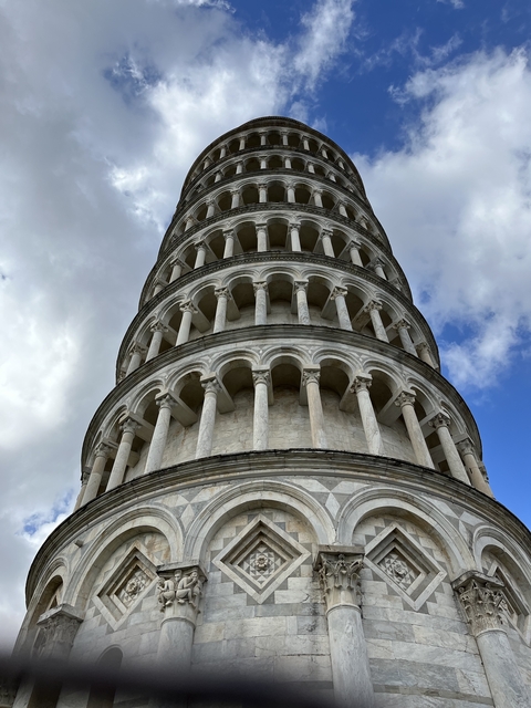       Close-up of the Leaning Tower of Pisa against a clear sky.
  