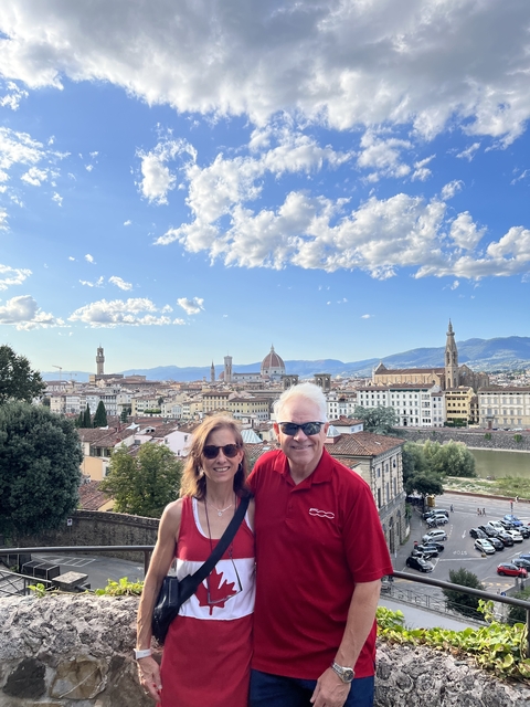 Couple with a panoramic view of Florence.
