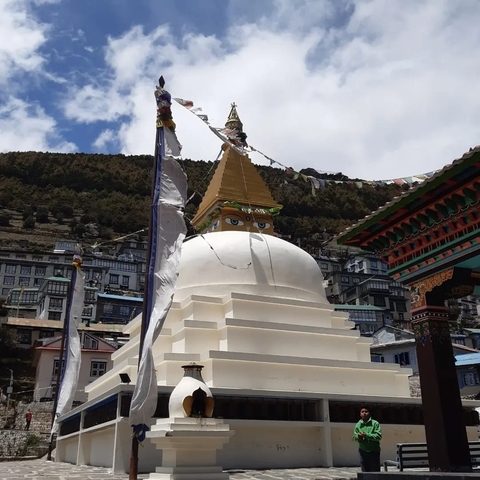 Stupa with eyes and prayer flags