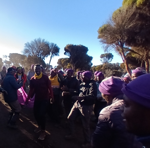 Group of people in a celebratory mood outdoors.
