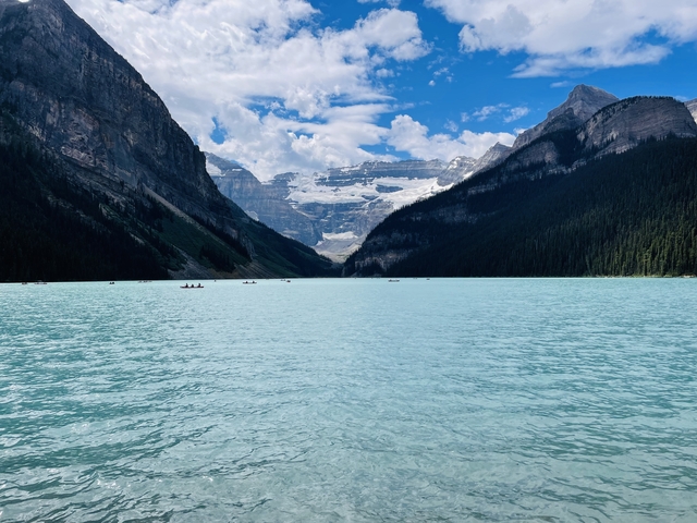       Stunning glacial lake with mountains in the background.
  