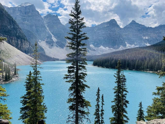       Mountain lake with clear blue waters and rugged peaks.
  